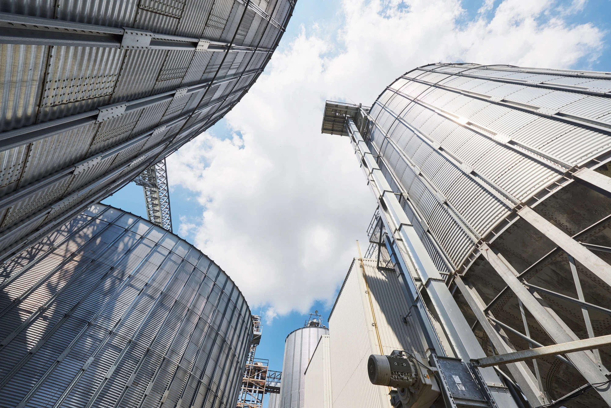 White industrial liquid storage tanks at a tank terminal facility on the Houston Ship Channel